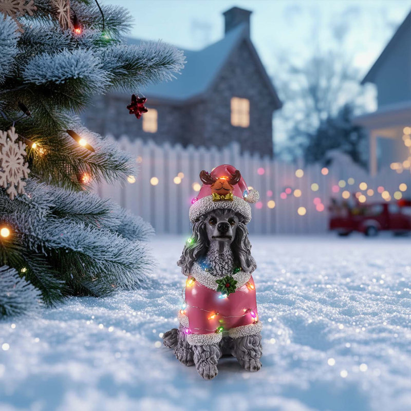 Charmante statue de caniche de Noël en tenue de père Noël rose, parfaite pour la décoration et la présentation des fêtes