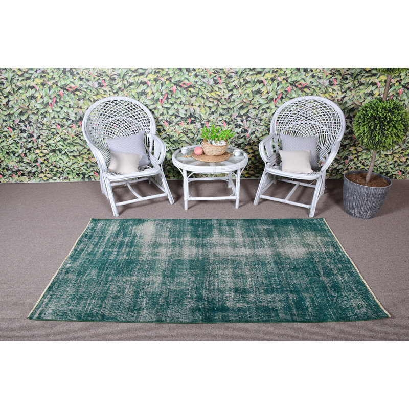 Tapis turc à motif rétro vert idéal pour décorer le salon