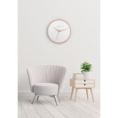 Sleek, modern wall clock in rose gold. Quartz time only movement.