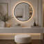 Miroir de salle de bain rond de 28 pouces avec cadre en aluminium noir, éclairage DEL à intensité variable et traitement antibuée-416982944