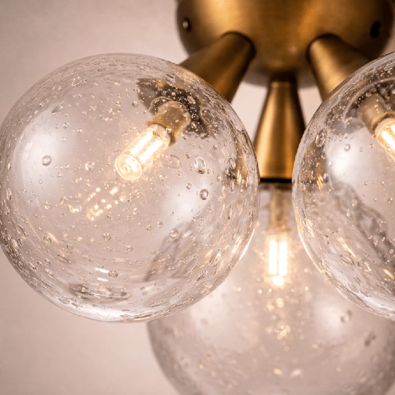 Orbit 3-Globe Aged Brass Semi-Flushmount