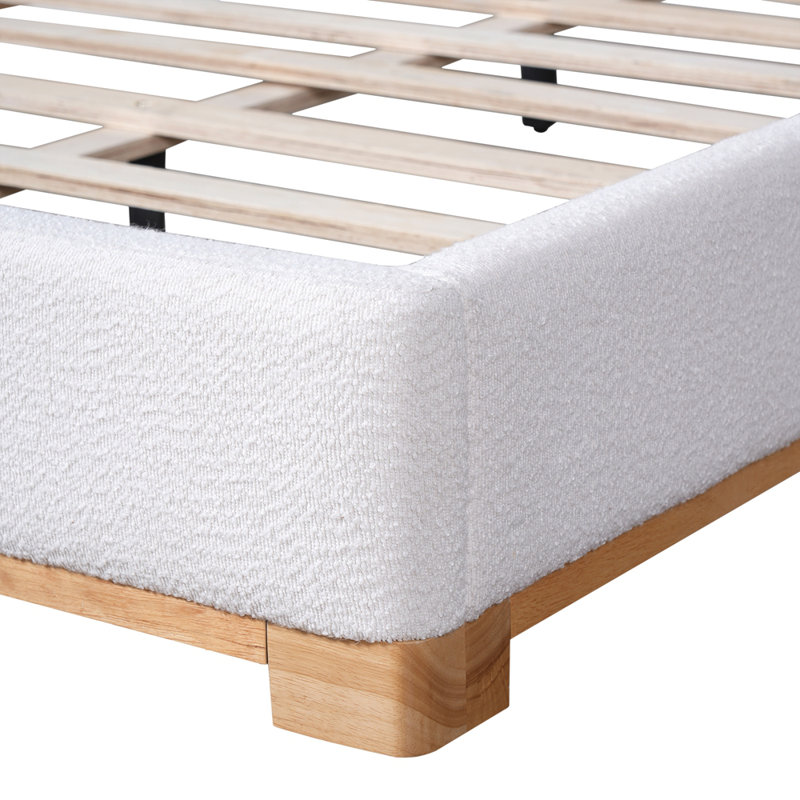 Structure de lit avec tête de lit courbée et rembourrée et base en bois massif, parfaite pour les chambres modernes et élégantes