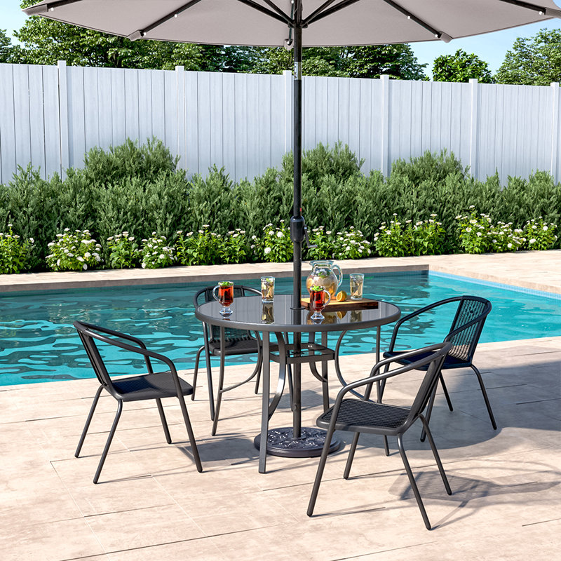 Mclin 4 - Person Patio Dining Set with Round Table , Cushions Included