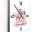 Horloge murale en métal rose-111742499