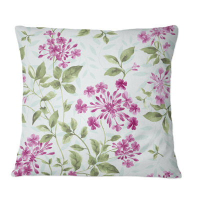 Coussin décoratif à motif de fleurs roses sur fond bleu clair
