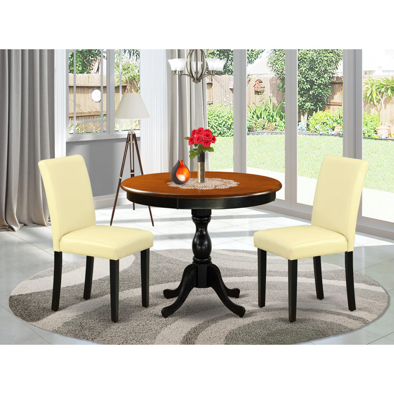 3 Piece Kitchen Table Set Contains a Round Dining Room Table with Pedestal and 2 Eggnog Faux Leather Parson Dining Chairs, Black & Cherry
