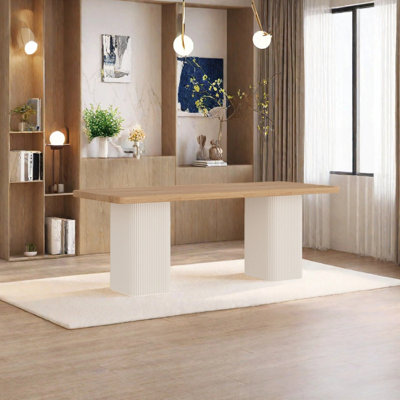 A cream solid wood dining table that saves space