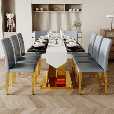 Ensemble de table de salle à manger de luxe avec plateau en verre et chaises en similicuir, ensemble de table de cuisine moderne avec pieds en métal doré
