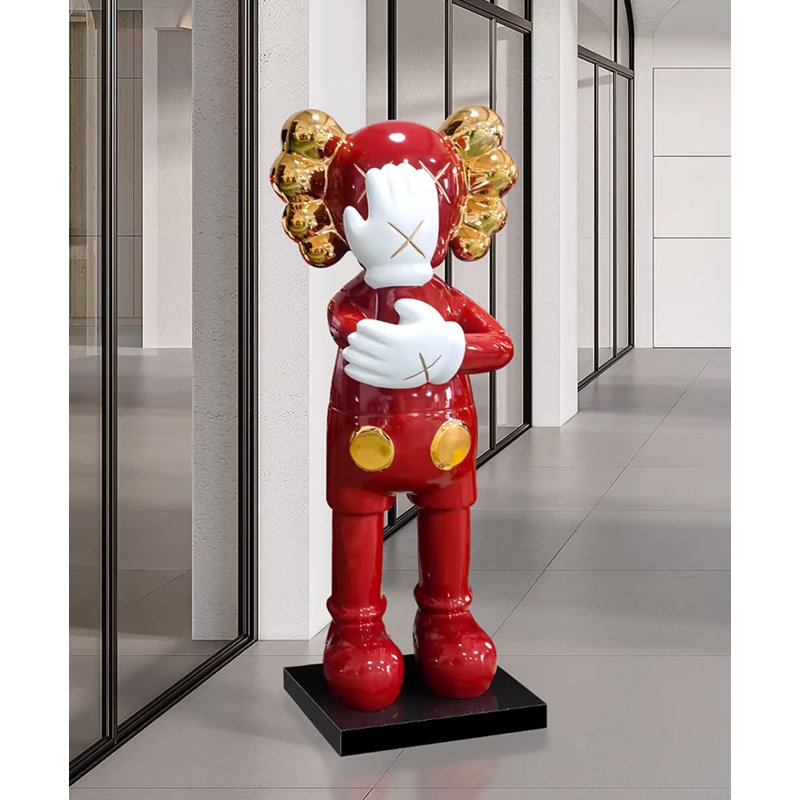 KAWS - Inspired large black and gold resin sculpture with plated details and marble base, 29.1" H x 11" W x 10.2" D, Red