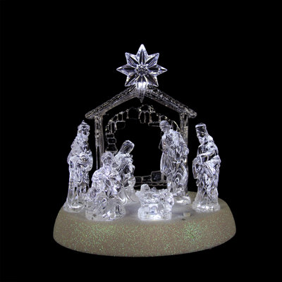 Crèche de noël avec une famille saint-siège