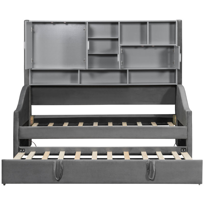 Lit de jour gris avec accoudoirs à DEL, tablettes de rangement et lit gigogne escamotable, conception orientée confort, lueur ambiante pour une atmosphère relaxante, idéal pour accueillir des invités
