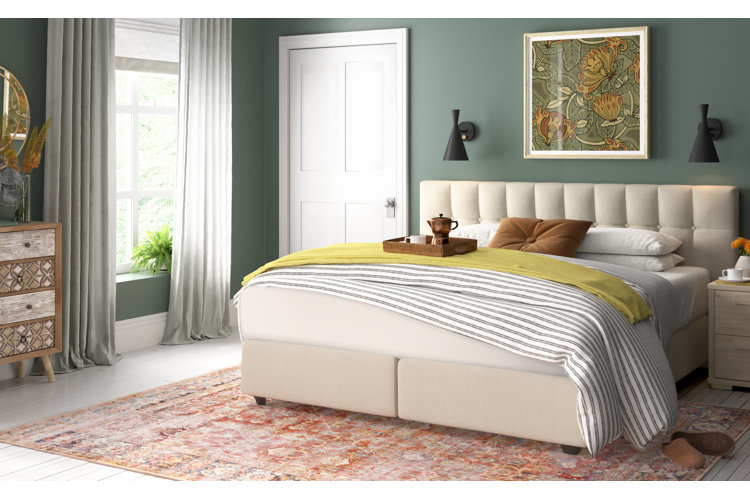 cream-colored queen-size comforter, white pillows, and gray knit throw blanket