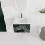 Meuble-lavabo mural 24 po. Contreplaqué noir avec porte à fermeture en douceur. Évier en céramique pour une construction moderne et paisible.