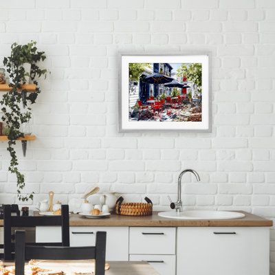 Cafe Classic Red Chairs Framed Print Under Glass, design by Franklyn Gregory