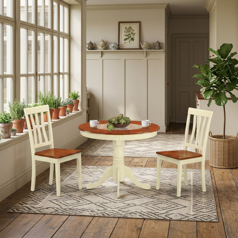 Ensemble table et chaises rondes en hévéa noir avec 2 chaises ergonomiques. Parfait pour les petits espaces. Montage facile. Finition nécessitant peu d'entretien.