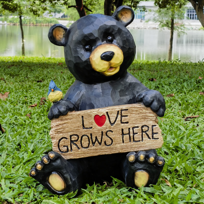 Ours assis tenant un signe d'amour, décoration de jardin