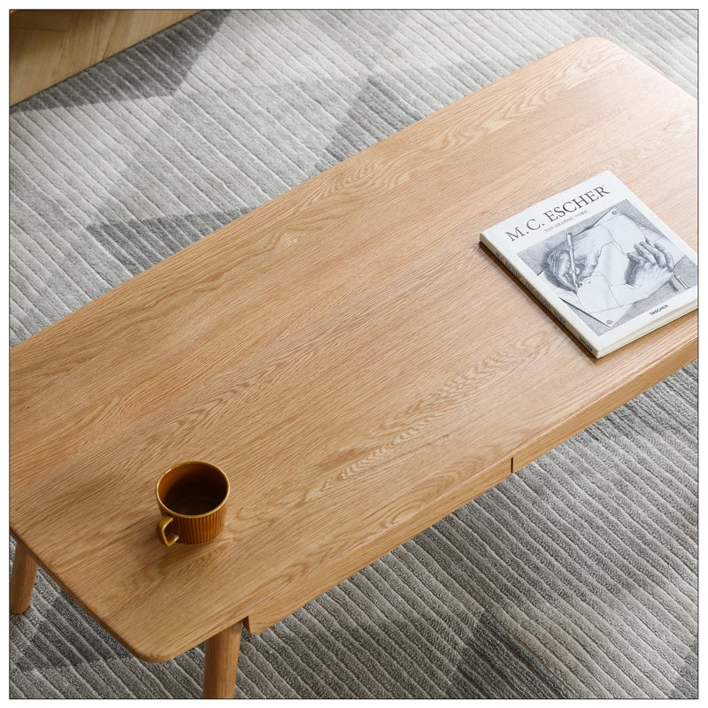 Table centrale polyvalente en bois massif avec rangement et fonction d'écriture, idéale pour le bureau personnel et la détente.