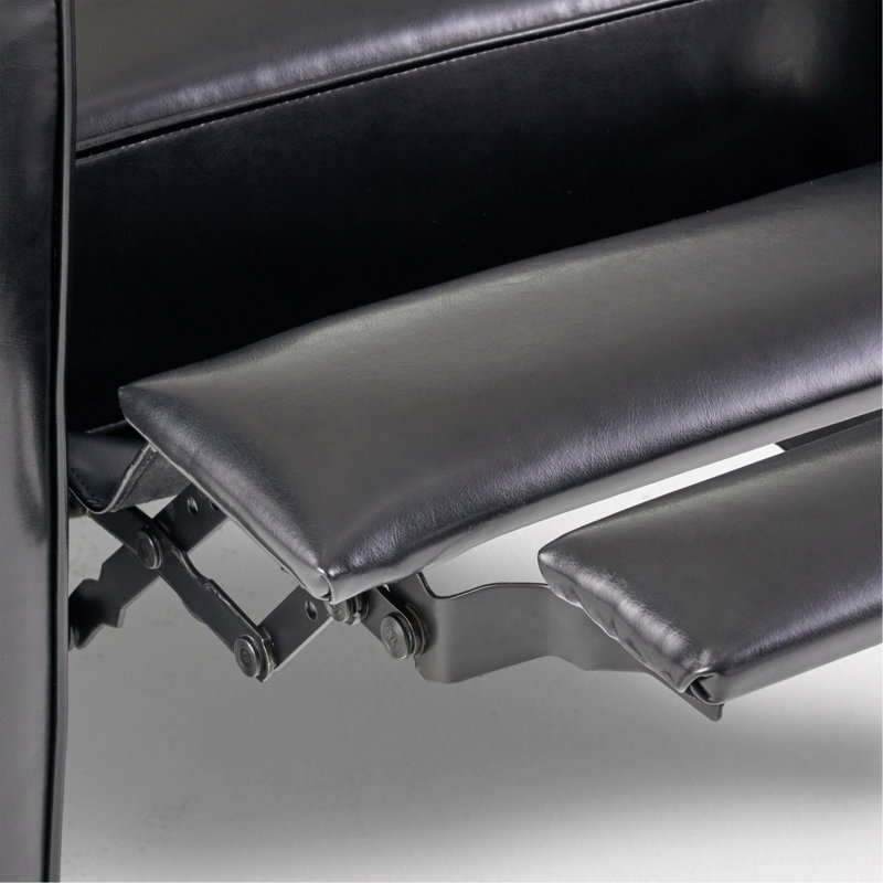 Fauteuil à dossier poussoir en cuir noir pour une décoration intérieure élégante