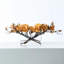 Branche de magnolia Golden Golden Blooms dans un vase de poche ovale
