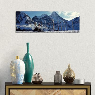 Skis And Ski Poles On A Snow Covered Landscape, Mt Assiniboine, Mt Assiniboine Provincial Park, British Columbia, Canada by Panoramic Images - Wrapped Canvas Panoramic Gallery-Wrapped Canvas Giclée