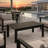 All-Weather Metal Outdoor Coffee Table With Wood-Look Top And Black Frame