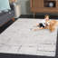 Tapis noir / ivoire en laine / coton touffeté à la main Anindita-391691303
