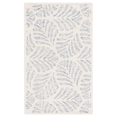 Tapis floral ivoire / bleu en laine touffeté à la main Mcconnico