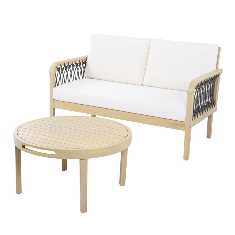 Ensemble de causeuse et table basse d'extérieur en bois d'acacia avec détails en corde tissée à la main et coussins gris foncé, finition teck clair