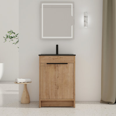 Meuble-lavabo 24 po avec lavabo. Portes à fermeture en douceur, poignée en métal, tablette réglable. Armoire en contreplaqué en céramique noire autoportante. 2