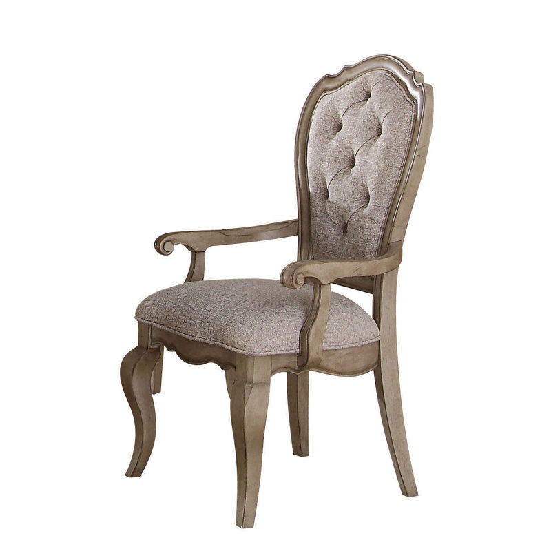 Fauteuil capitonné en tissu gris