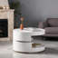 Table basse ronde avec plateau tournant et rangement caché, bois manufacturé blanc doux, largeur 23,6