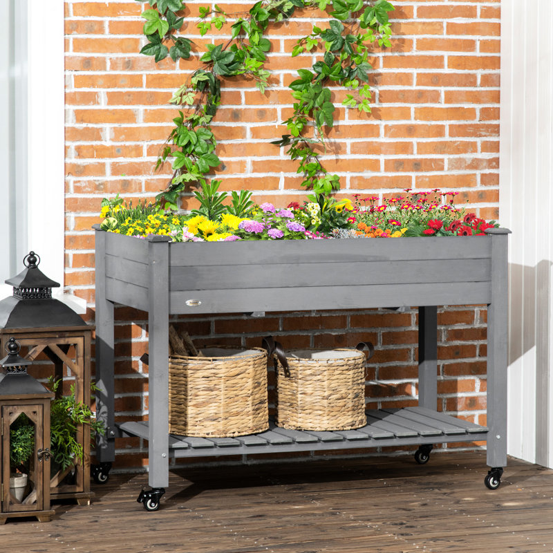 Lit de jardin surélevé Outsunny, jardinière en bois surélevée avec roues verrouillables, tablette de rangement et doublure de lit pour la cour arrière, le patio