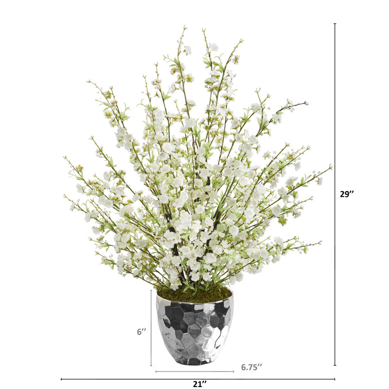 Arrangement floral de fleurs de cerisier artificiel dans un bol