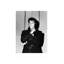 Elvis Presley riant lors d'une conférence de presse-78045383-78045384