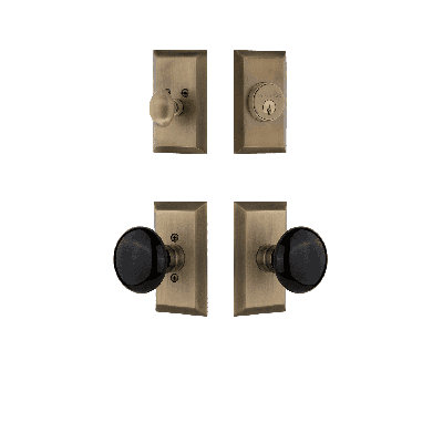 Nostalgic Warehouse Studio Entry Set With Black Porcelain Knob In Antique Brass-2 3/4" Backset-Universal Handing
