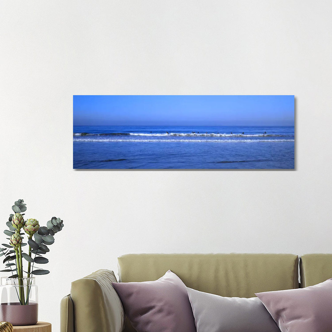 Surfers Riding A Wave In The Sea - Wrapped Canvas Panoramic Print
