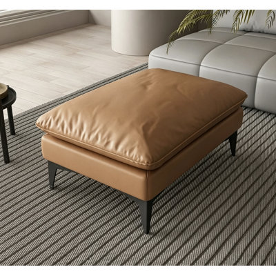 Repose-pieds en cuir avec coussin de duvet