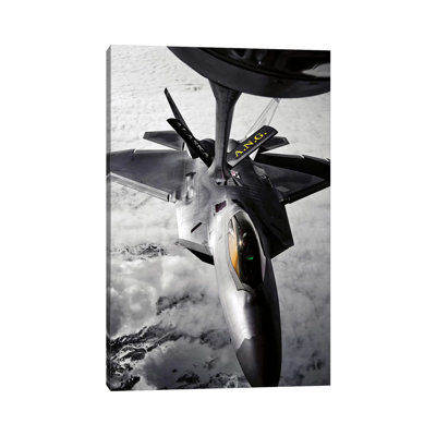 A KC-135 Stratotanker Refuels A F-22 Raptor by Stocktrek Images - Wrapped Canvas Print