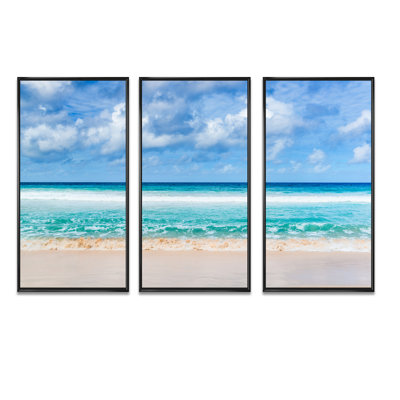 Tranquil Beach Under White Clouds - 3 Piece Floater Frame Print on Canvas