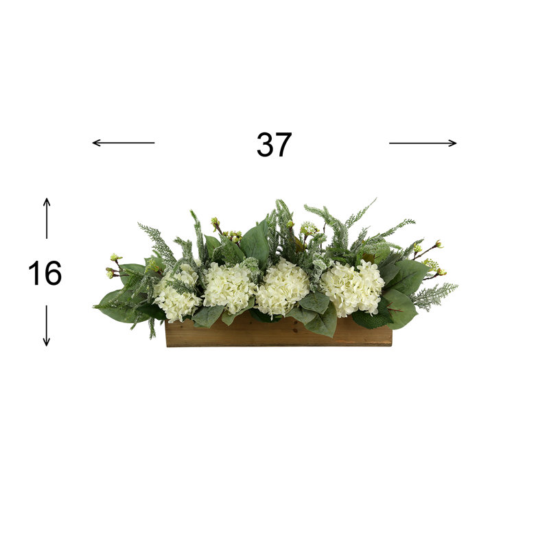 Holiday Arrangement with Wintry Greens and Hydrangeas