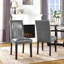 Chaise de salle à manger rembourrée avec garniture cloutée et dossier haut en similicuir LUMERA-914982205