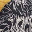Rosaliz Hand Tufted Wool/Cotton Floral Rug in Black/Ivory-1696657282