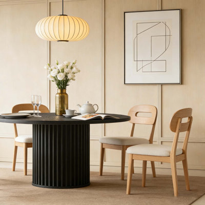 Table de salle à manger ronde cannelée noire de 47,24 pouces avec base en métal pour 4 à 6 personnes, parfaite pour l'élégance et la durabilité Mid-Century