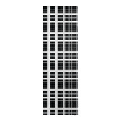 Tapis noir à carreaux