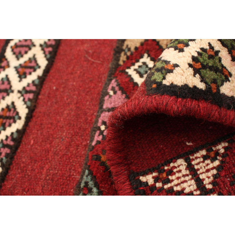 Tapis rouge foncé en laine noué à la main
