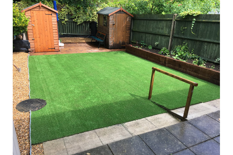 green turf laid out in a small backyard