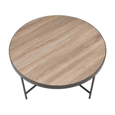 Table basse ronde en bois avec structure en métal, finition grise vieillie pour un décor industriel moderne
