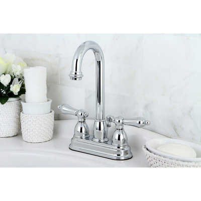Kingston Brass Restoration Two-Handle 3-Hole Deck Mount 4" Centerset Bathroom Faucet with Plastic Pop-Up