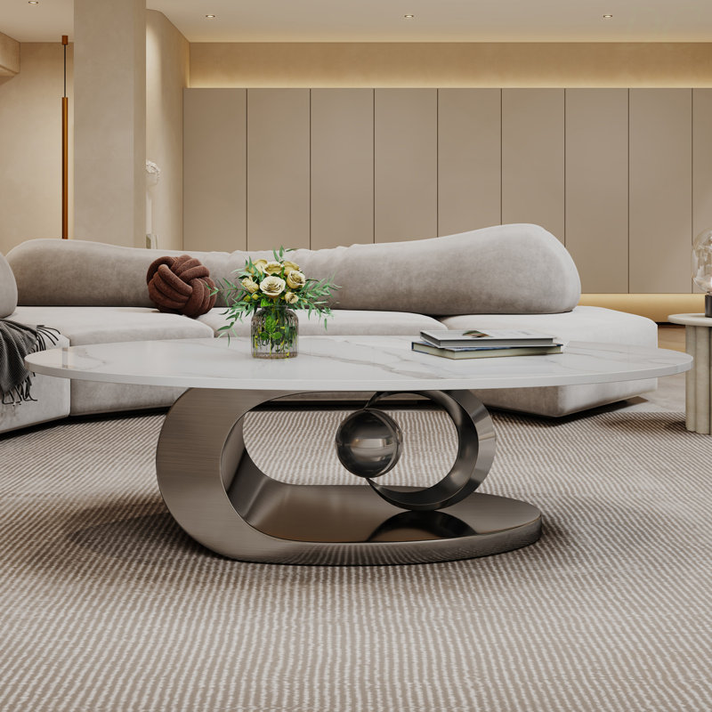 Table basse en marbre avec base sculpturale en acier inoxydable, table basse