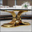 Table basse moderne en faux marbre avec plateau en pierre frittée résistante et piètement en acier inoxydable, idéale pour les salons élégants.